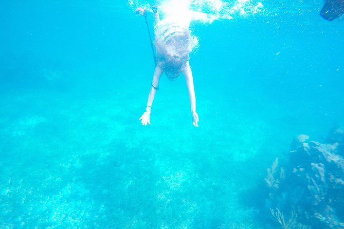 Snorkel, ATV, Zipline and Cenote Adventure from Cancun - Speedboats and the reef near Puerto Morelos