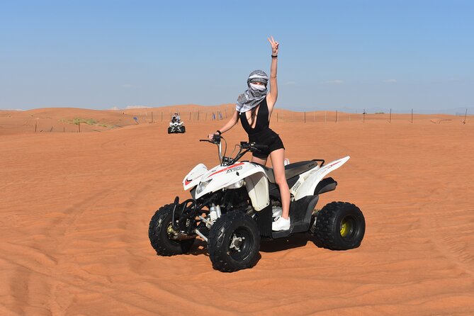 Sunset Desert Safari Quad bike Camel ride Sand Board & BBQ Dinner - Dune bashing with a sunset photo stop